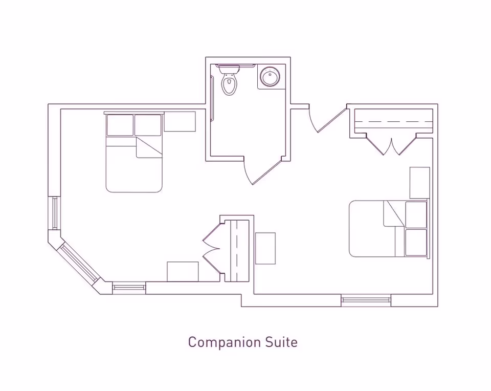 Architectural floor plan of a companion suite showing two bedrooms, a shared bathroom with a toilet and sink, closets, and windows.