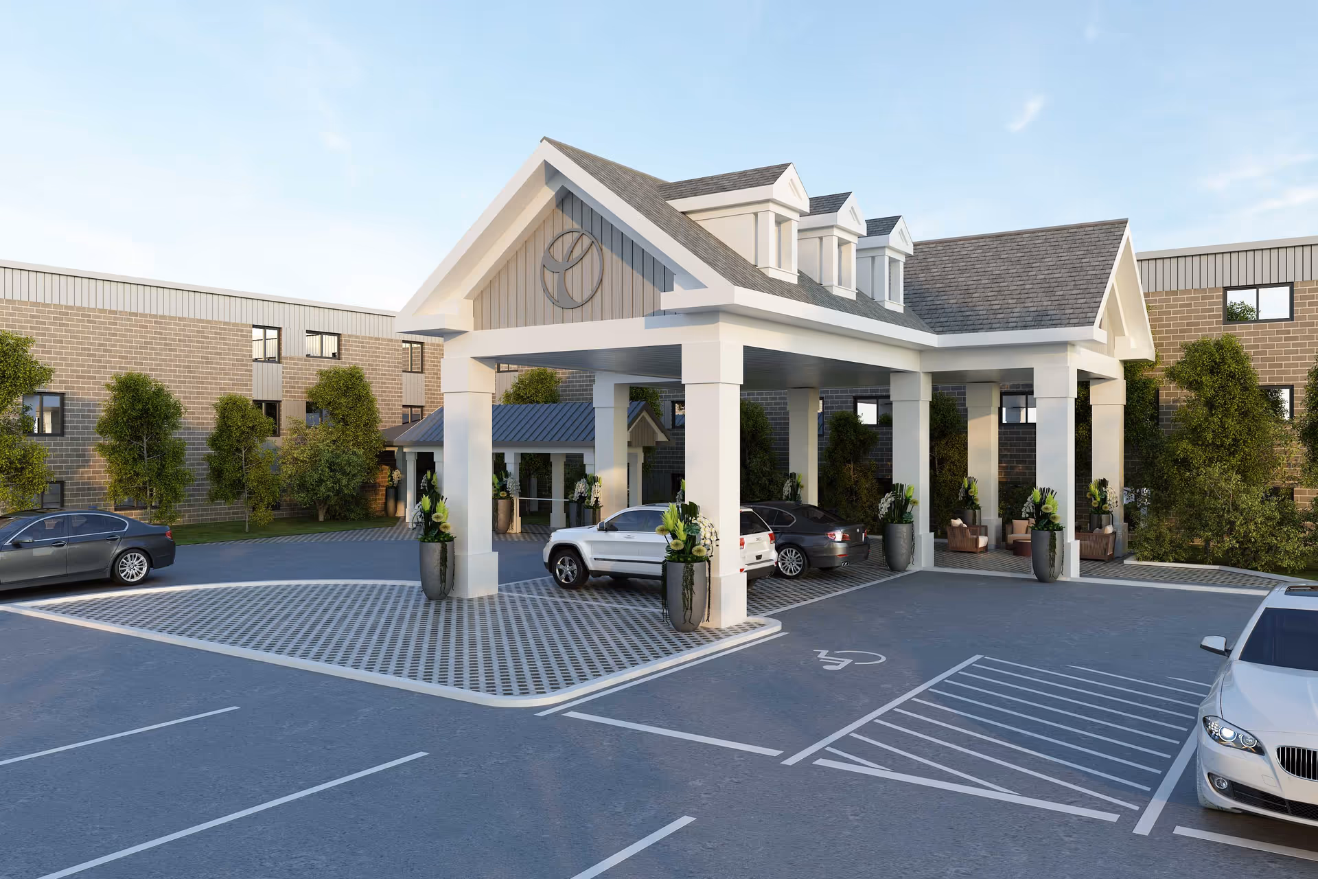 Exterior view of St. Paul's senior living facility entrance with a covered drop-off area, several parked cars, and surrounding greenery under a clear sky.