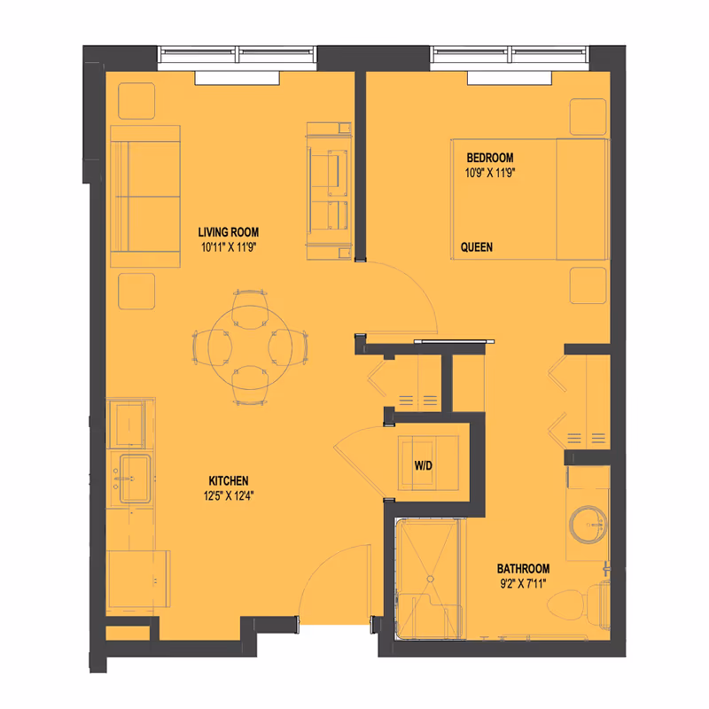 Floor plan of a one-bedroom apartment at American House Boynton Beach showing a living room, kitchen, bedroom with queen bed, bathroom, and washer/dryer area.