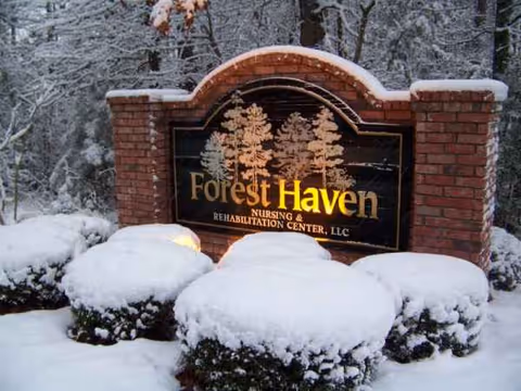 Snowy outdoor brick sign reads Forest Haven Nursing and Rehabilitation Center.
