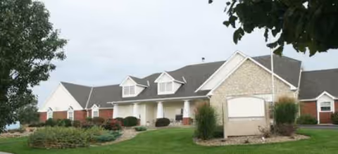 Exterior view of Brookdale Junction City facility with landscaped lawn and driveway.