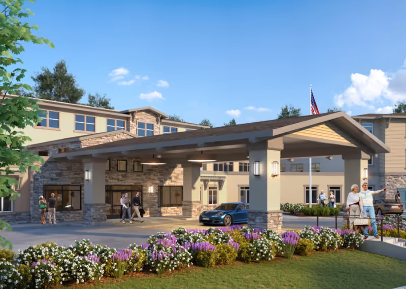 Front view of The Grove at Los Gatos exterior with entrance canopy and flowering beds.