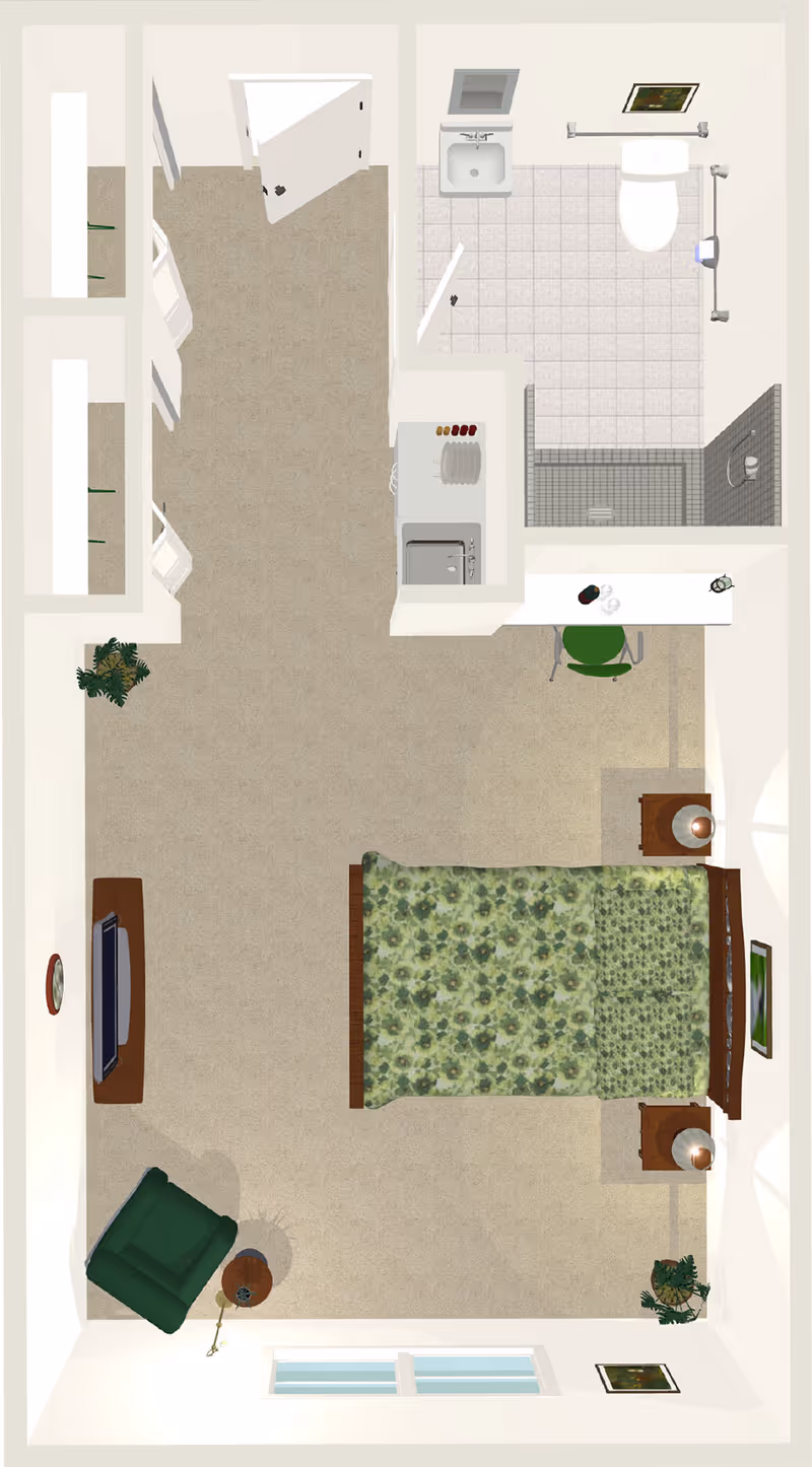 Top-down view of a senior living facility room at Oakview Park featuring a bed with green floral bedding, two bedside tables with lamps, a green armchair with a small round table and lamp, a TV mounted on a stand, a desk with a green chair, a kitchenette with a sink and dishes, and an adjacent bathroom with a toilet, sink, and shower.