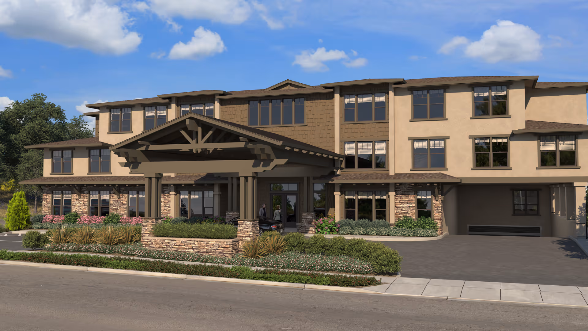 Front exterior view of The Vincent senior living facility, showing a three-story building with a covered entrance, stone and beige stucco facade, multiple windows, landscaped greenery, and a clear blue sky with some clouds.