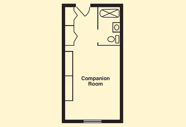 A floor plan of a companion room featuring a bed, a bathroom, and seating areas.