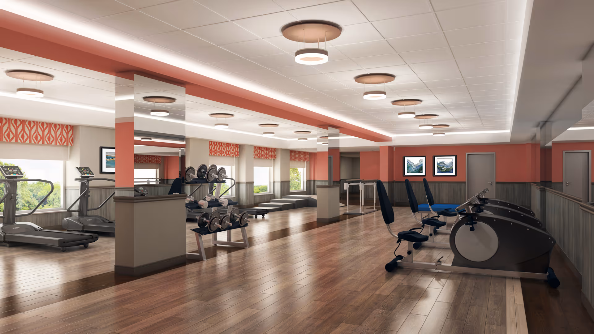 Well-lit fitness room with treadmills, recumbent bikes, free weights, and mirrors.
