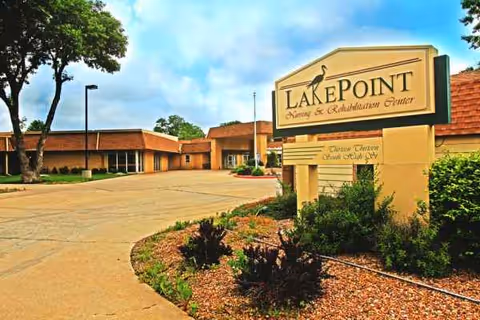 Exterior view of LakePoint El Dorado facility with a sign and landscaping.
