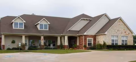 Exterior view of Brookdale Lakeshore, a senior living facility with a covered entrance.