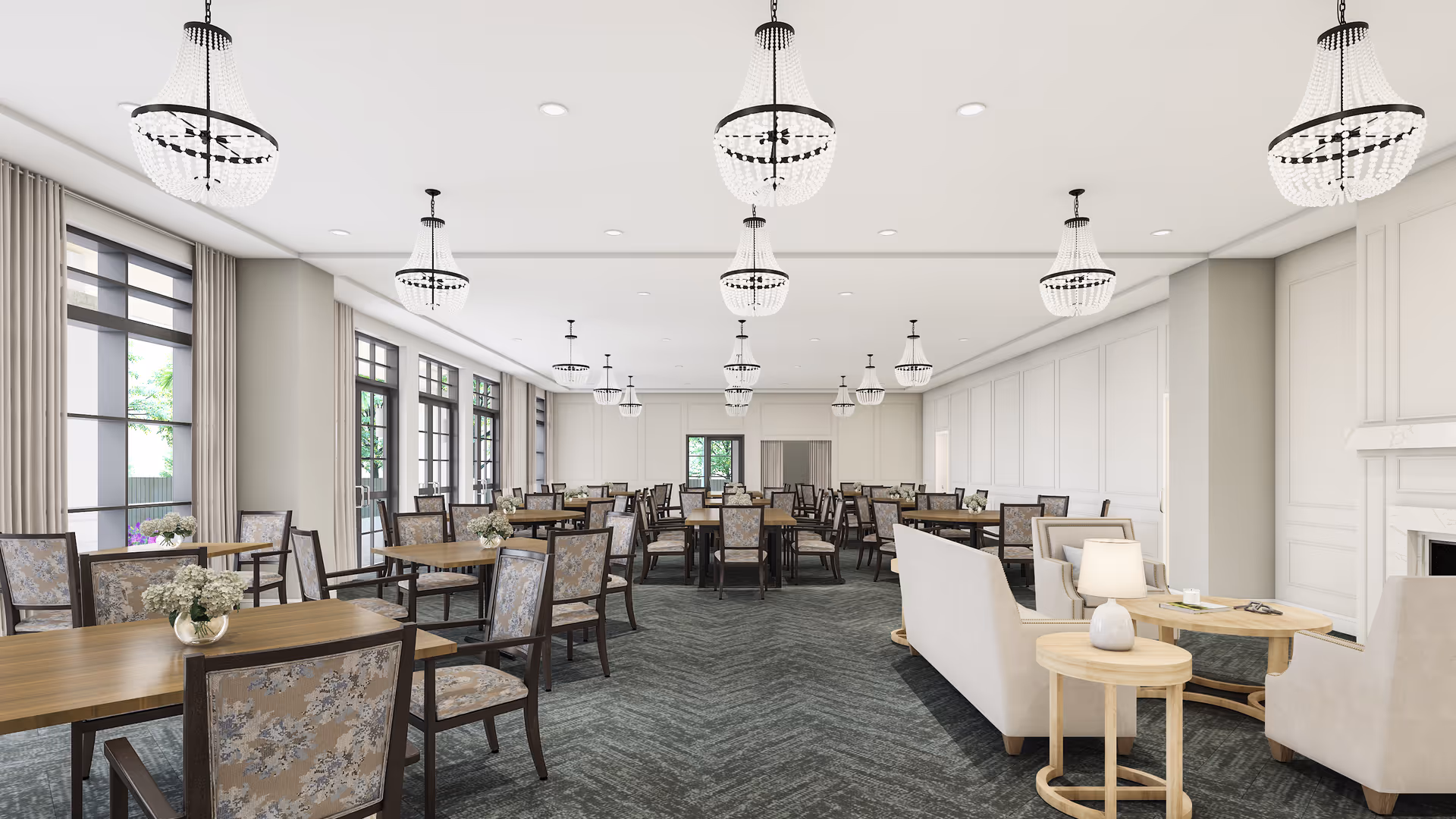 Spacious bright dining and lounge area with multiple tables, chairs, sofas, and chandeliers.