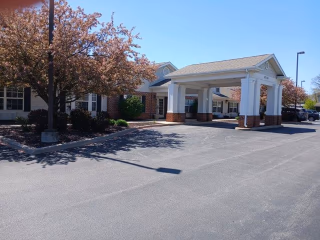 Exterior view of The Terrace at Ft Wayne entrance with covered drop-off and landscaping