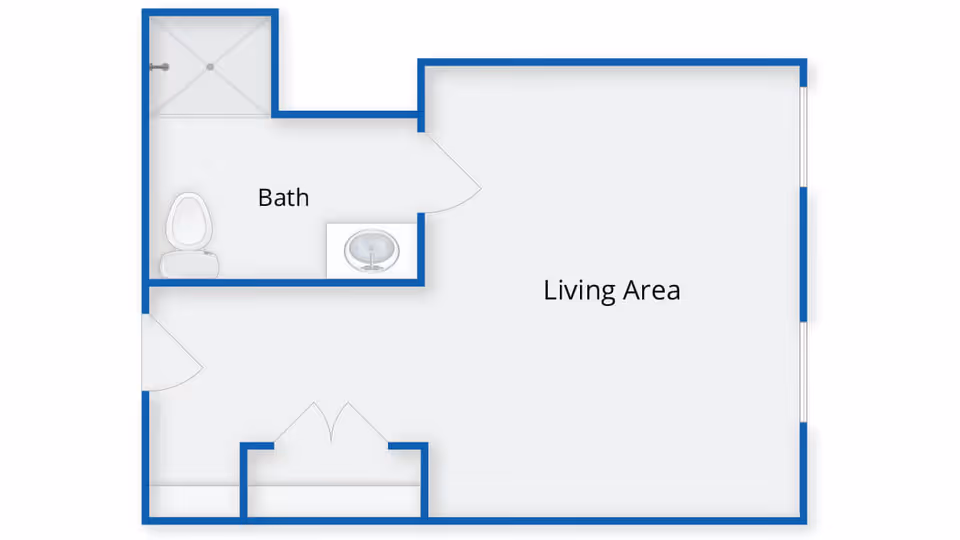 Floor plan layout showing a living area connected to a bathroom with a shower, toilet, and sink.