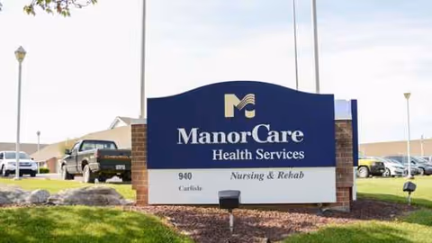 Exterior sign for ManorCare Health Services Carlisle Nursing & Rehab at a grassy lot