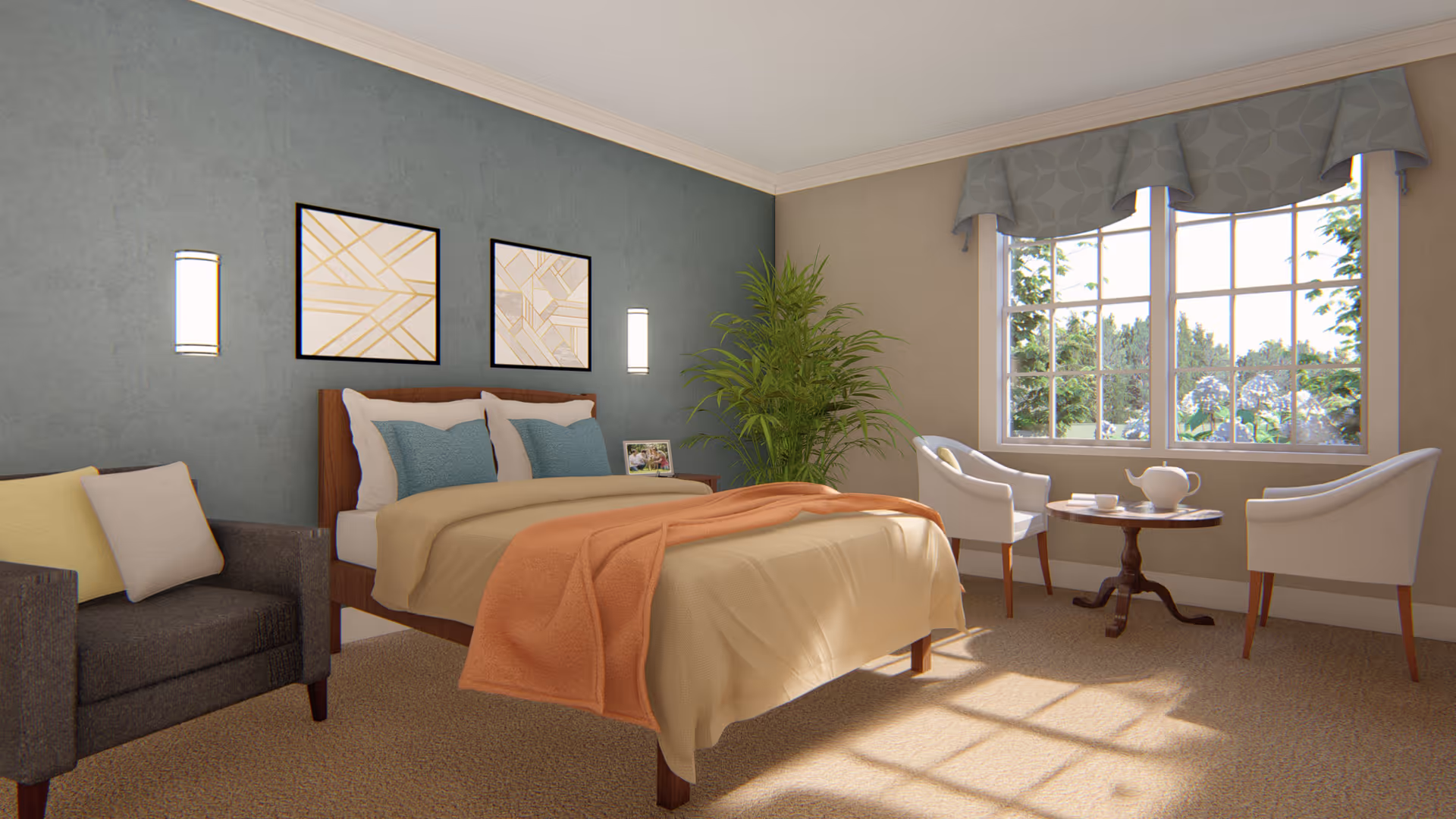 A bright and cozy bedroom with a large window letting in natural light. The room features a bed with beige and orange bedding, two blue pillows, a dark gray armchair with yellow and white cushions, a small round wooden table with a white teapot and cups, and two white chairs. There are two framed abstract art pieces on the blue accent wall behind the bed, and a tall green plant in the corner near the window.