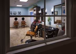 Hair salon within Williamsport Health & Rehabilitation Center with chairs and sinks.