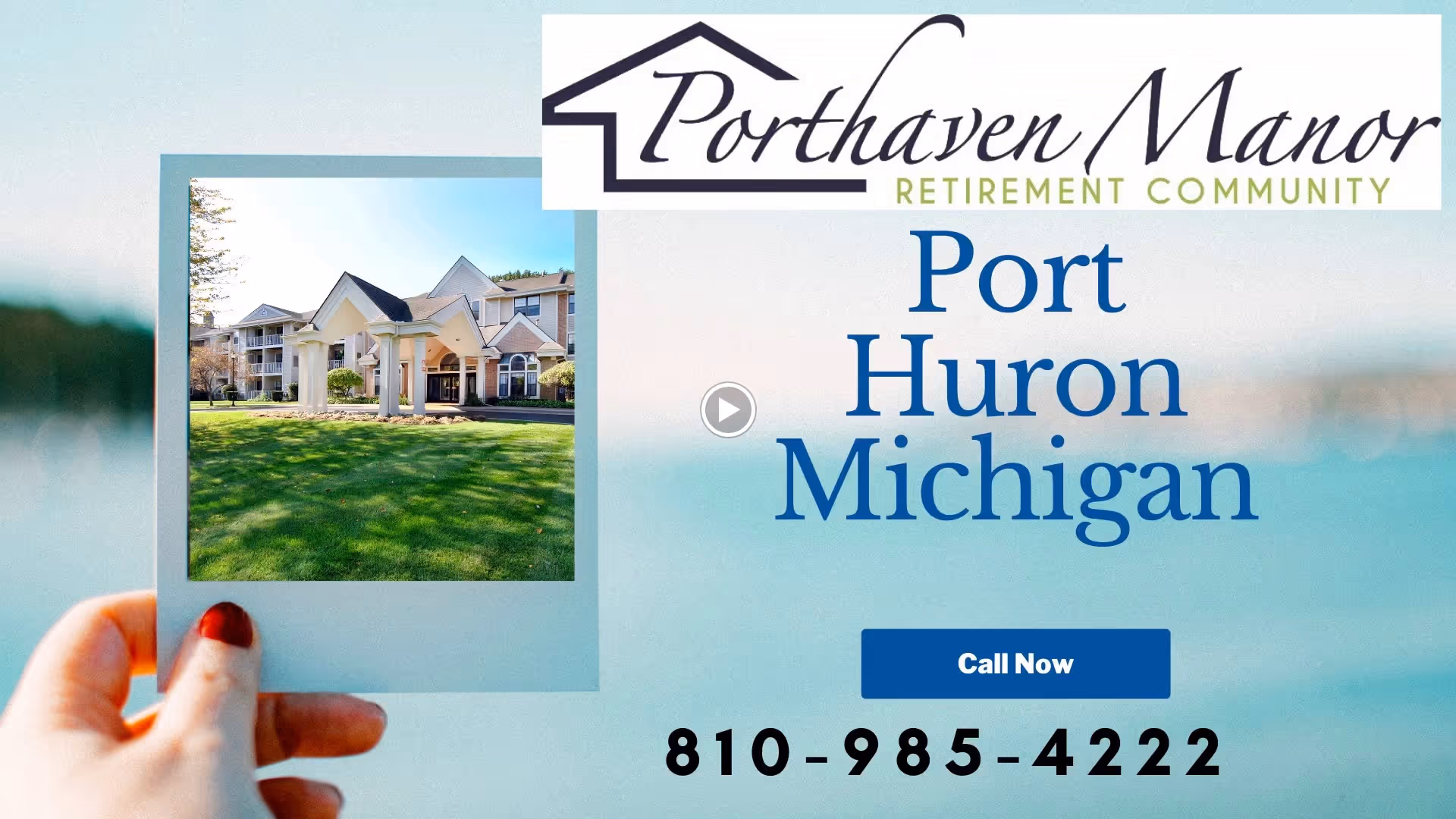 A hand with red nail polish holding a photo frame showing the exterior of Porthaven Manor, a retirement community building with a covered entrance and green lawn. The image includes text with the facility name, location Port Huron Michigan, and a phone number to call.