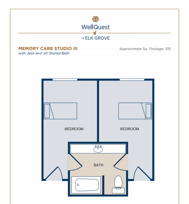 Floor plan of Memory Care Studio III at WellQuest of Elk Grove showing two bedrooms with a shared Jack and Jill bathroom in between. Each bedroom has a bed and a door leading to the shared bathroom, which contains a bathtub, toilet, and sink.