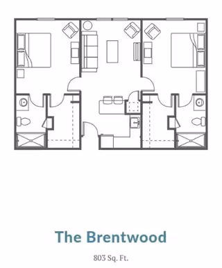 Architectural floor plan of The Brentwood unit at Village on the Park Steeplechase, showing a layout with two bedrooms, two bathrooms, a central living room with seating, and a kitchen area. The total area is 803 square feet.
