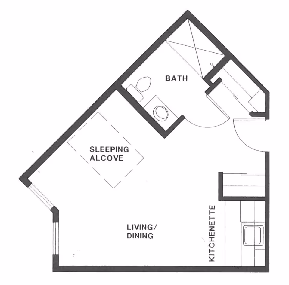 Architectural floor plan of a small living space featuring a sleeping alcove, a combined living and dining area, a kitchenette, and a bathroom with a shower, toilet, and sink.
