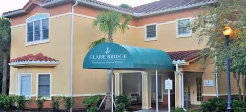 Exterior view of Homewood at Sun City Center with teal entrance canopy.