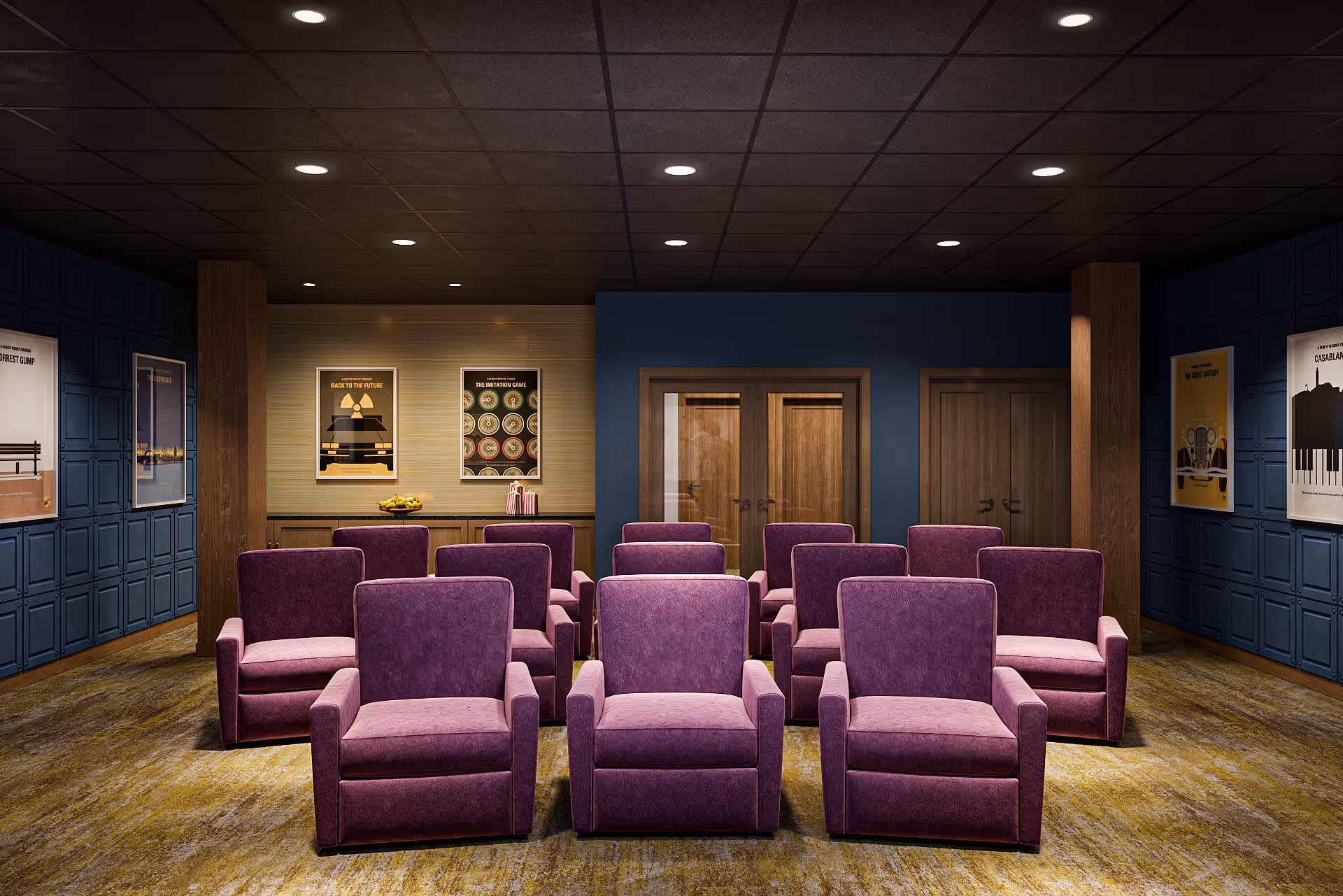 A small theater or screening room with three rows of purple upholstered armchairs facing a screen or stage area. The room has dark blue paneled walls with movie posters framed and hung on them, a carpeted floor, and a ceiling with recessed lighting. There are wooden double doors at the back of the room.