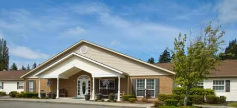 Exterior view of Brookdale Alderwood senior living facility entrance with landscaping.