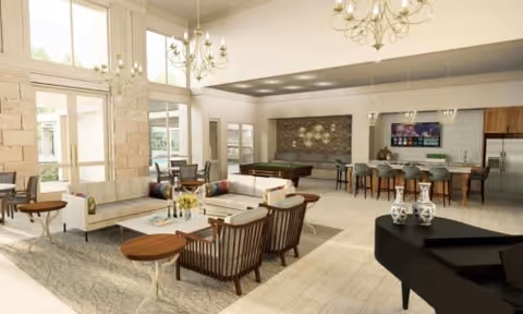 Bright, open senior living common area with sofas, armchairs, chandeliers, a pool table, piano, and a kitchen/bar.