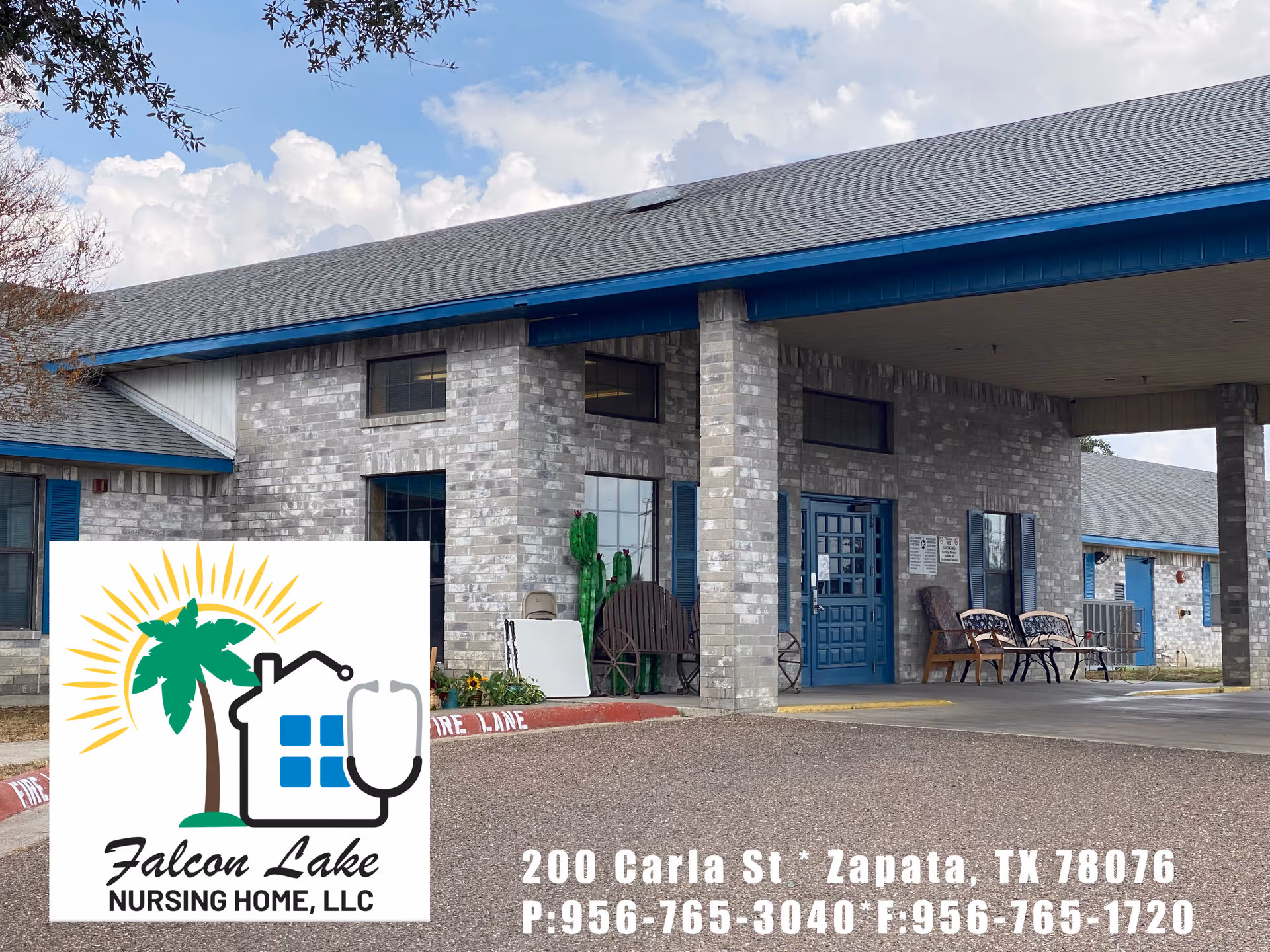 Exterior view of Falcon Lake Nursing Home LLC building showing a covered entrance with benches and chairs outside. The building is made of light gray brick with blue trim around the doors and windows. The sky is partly cloudy.
