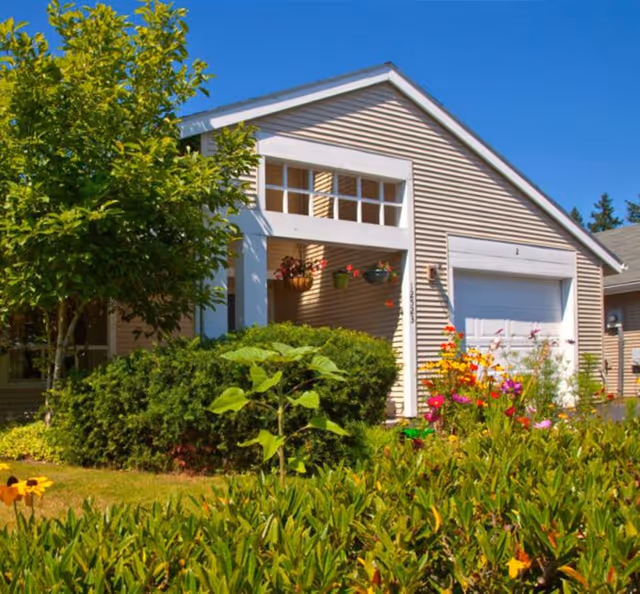 Front exterior of Ida Culver House Broadview with garden and hanging baskets