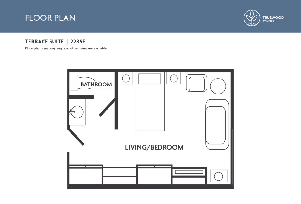 Floor plan of a Terrace Suite at Truewood by Merrill, Taylorsville, showing a combined living and bedroom area with a bed, chair, table, and storage units, along with a separate bathroom area including a sink and toilet.