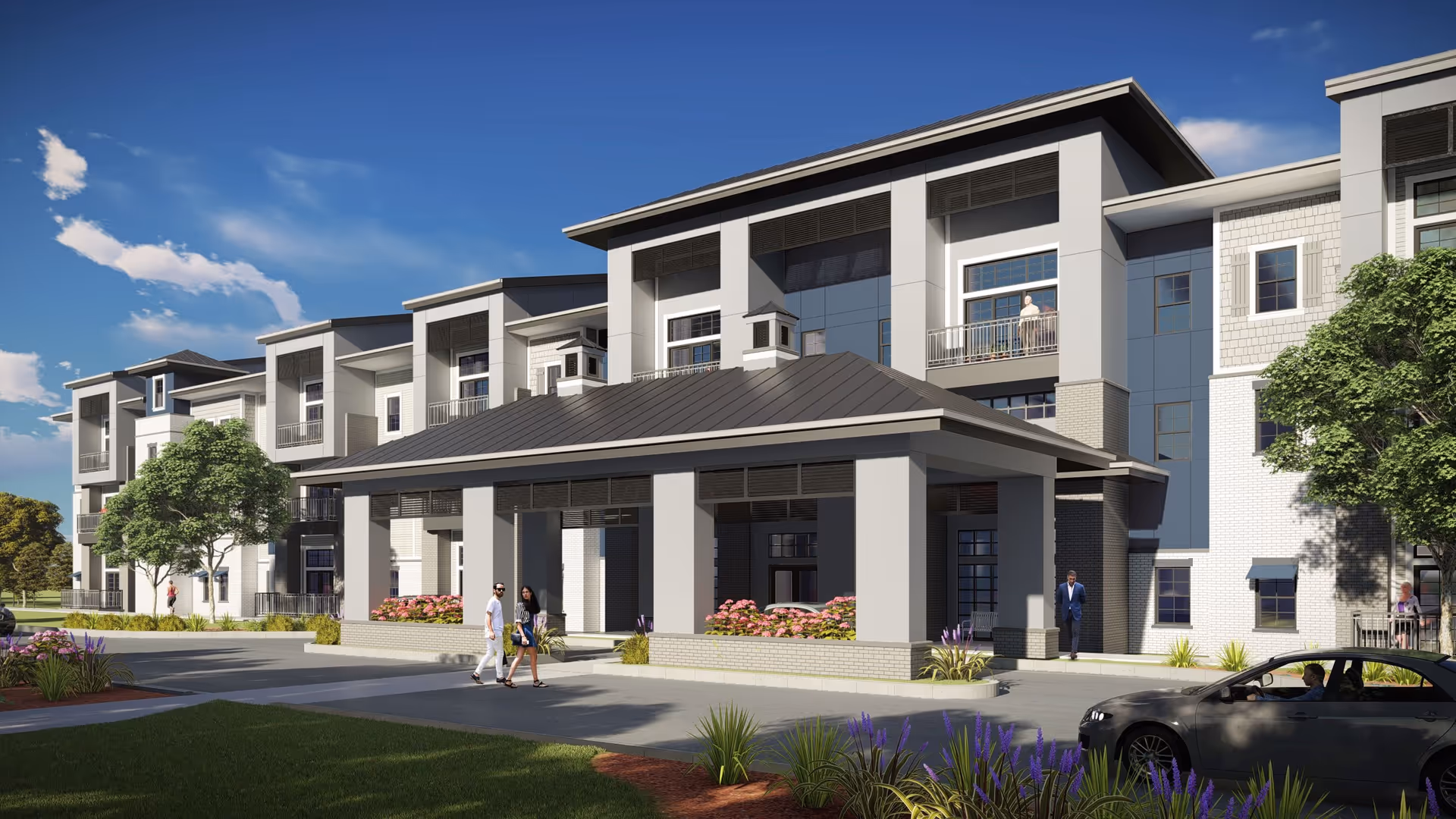 Exterior view of a modern multi-story senior living facility named Novel Place Blue Springs, featuring a covered entrance with columns, landscaped greenery, and several people walking or standing near the building under a clear blue sky.