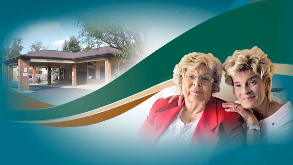 A promotional image featuring the exterior entrance of a senior living facility with a covered driveway and an American flag, alongside a photo of two elderly women smiling and posing closely together.