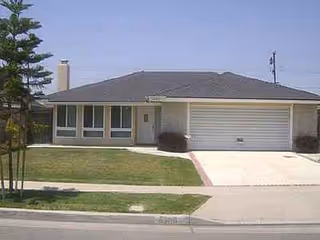 Kamstra Care Home is a single-story building with a garage, front yard, and sidewalk.