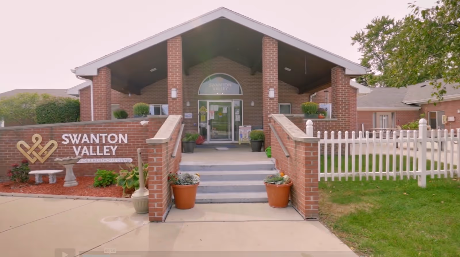 Front entrance of Swanton Valley Rehabilitation and Healthcare Center with landscaped area.