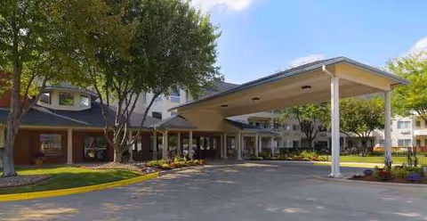 The Montvale Senior Living building with a covered entrance and landscaped grounds.