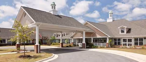 Exterior view of NC State Veterans Home-Kinston with a covered entrance and driveway.