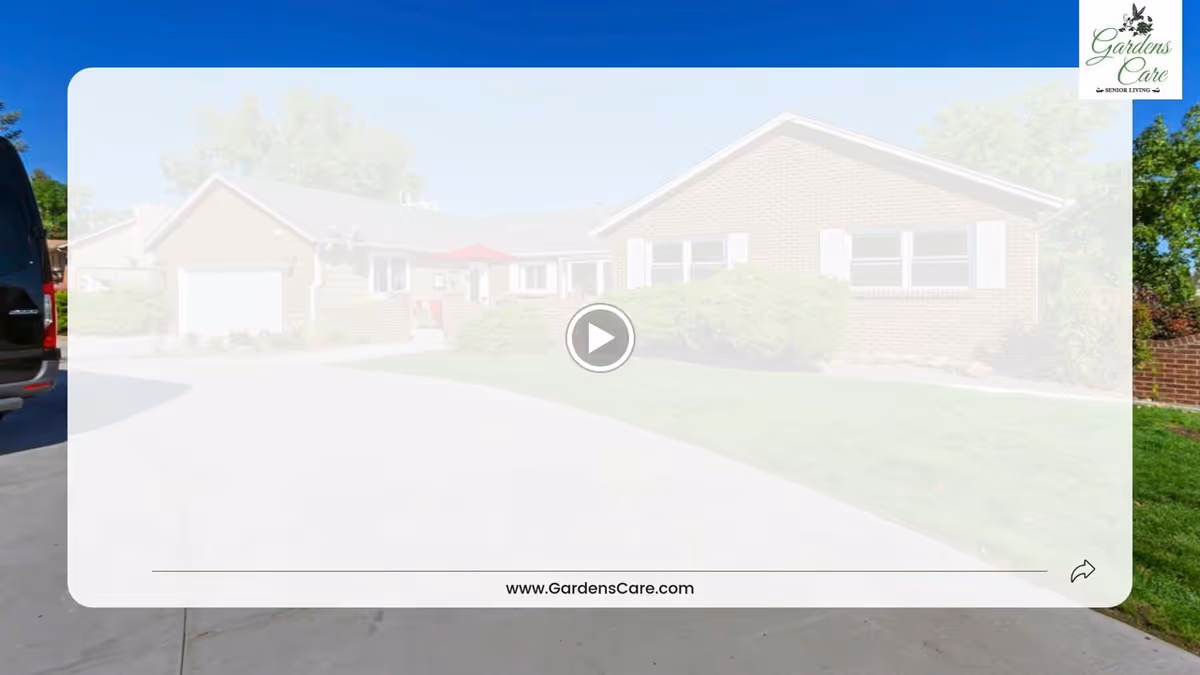 Front view of a single-story brick senior living building with a driveway, lawn, and entrance.