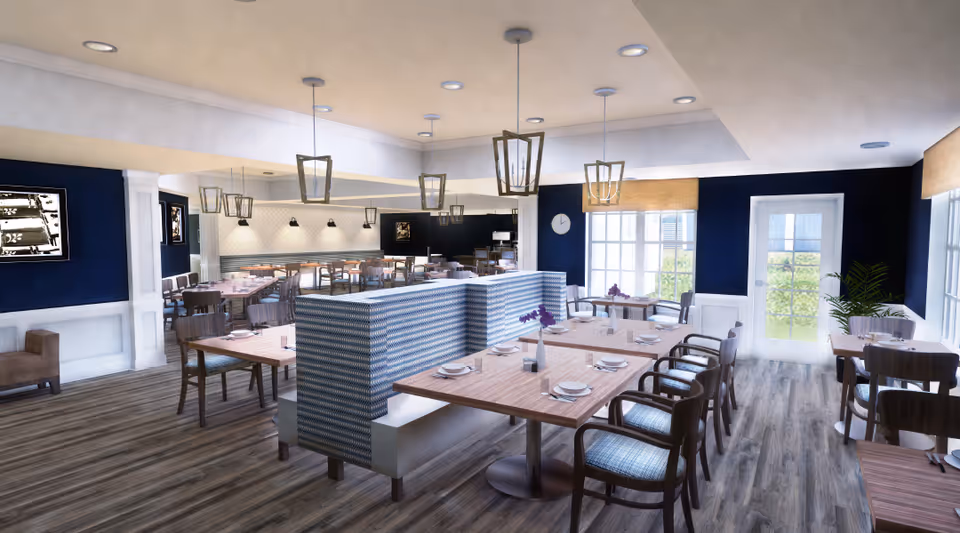 Spacious bright dining room with wooden tables, upholstered booth and chair seating, pendant lighting, and large windows.