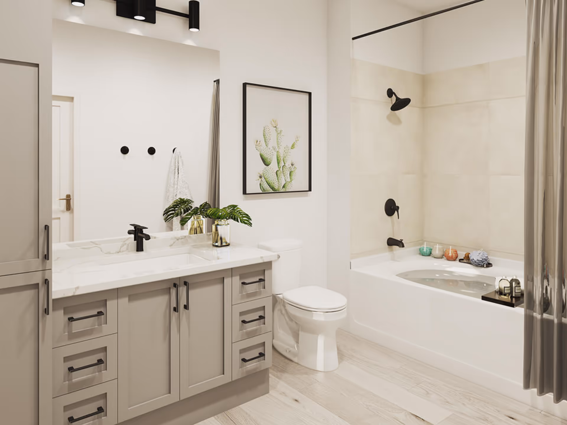 Modern bright bathroom featuring a vanity with a marble countertop, toilet, and a bathtub-shower with beige tile.