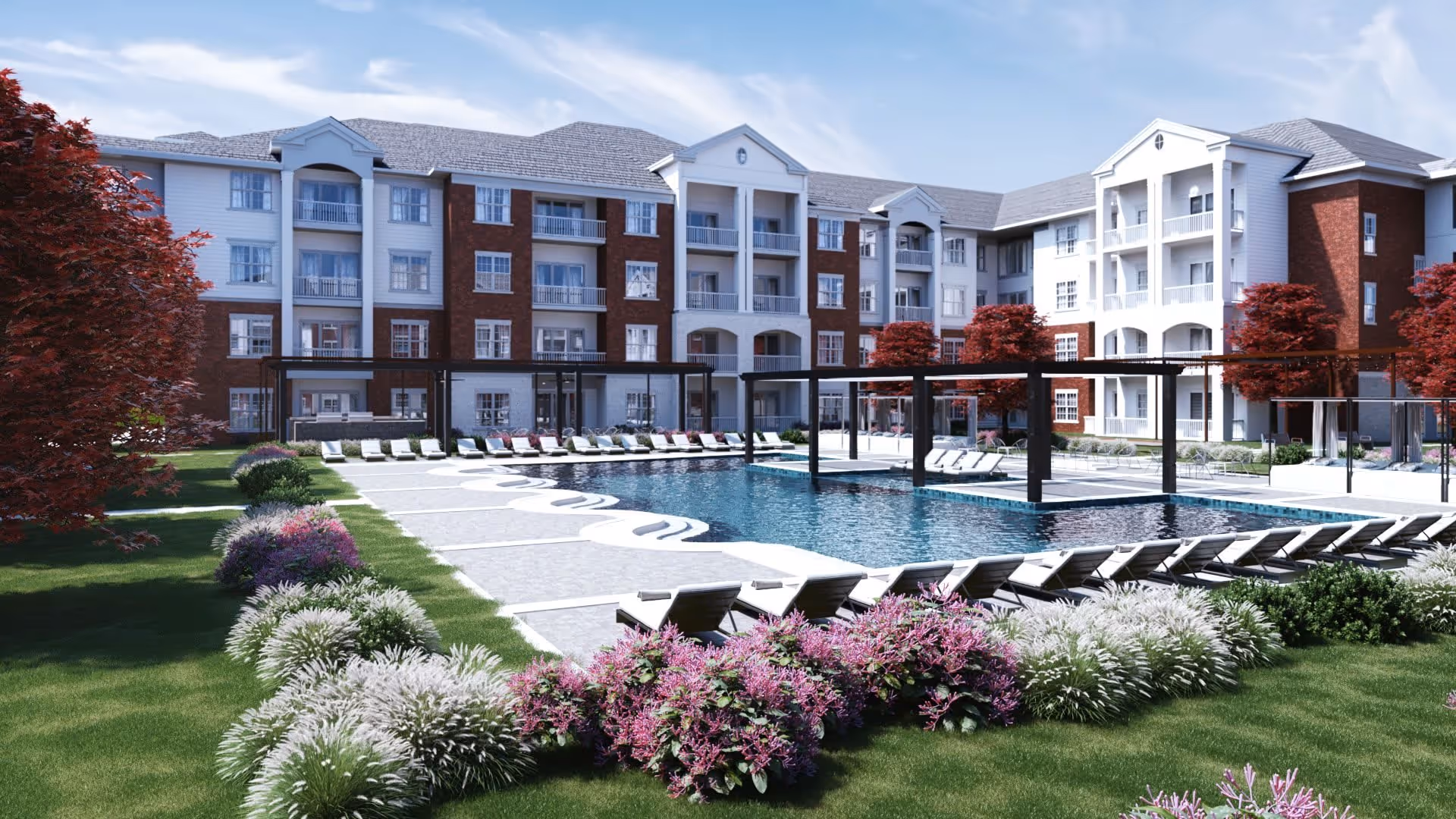 Outdoor courtyard of a senior living complex featuring a central swimming pool, rows of lounge chairs, landscaped plantings, and a multi-story brick-and-white building behind it.