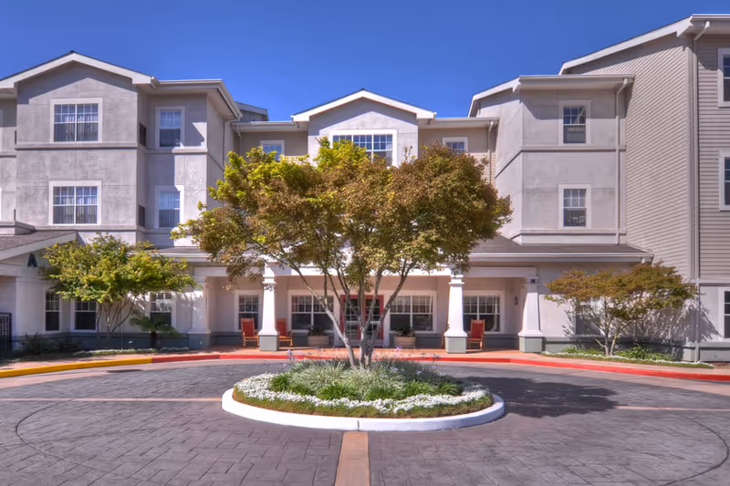 Exterior view of Ivy Park at San Jose with a circular landscaped island.