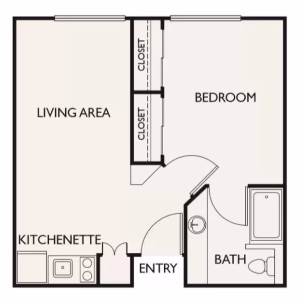 Floor plan of a senior living unit at Coastal Heights Senior Living showing a living area, kitchenette, entry, bedroom with two closets, and a bathroom with a bathtub, toilet, and sink.
