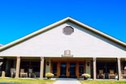 Front view of Courtyard Manor of Farmington Hills senior living facility entrance.