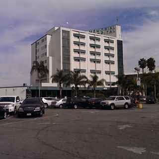 Multi-story hospital building labeled Memorial Hospital of Gardena with a parking lot