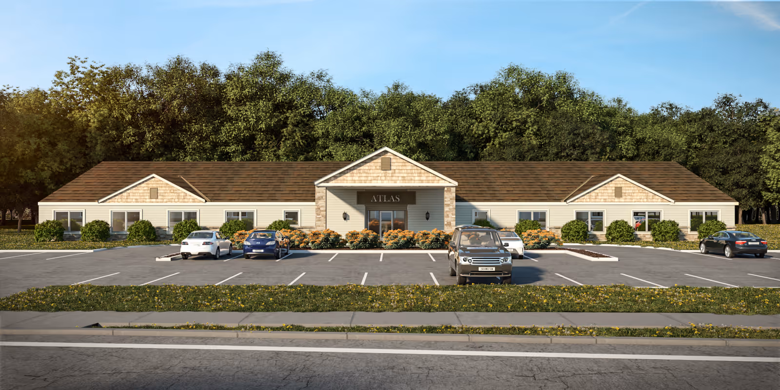 Front exterior view of a single-story building with a brown shingle roof and beige siding, labeled 'ATLAS' above the entrance. The building is surrounded by bushes and flowers, with a parking lot in front containing several parked cars. Trees are visible in the background under a clear blue sky.