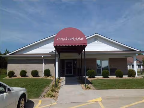 Front view of Forsyth Care Center entrance with a maroon awning.