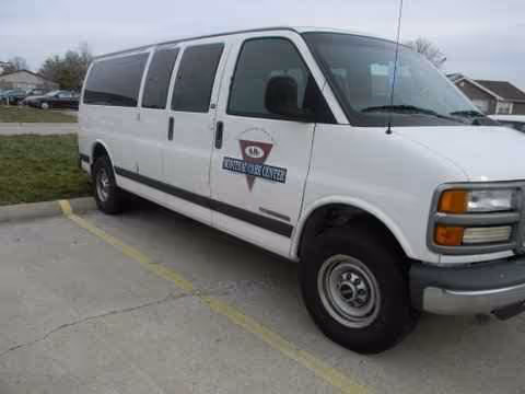 White Moniteau Care Center van parked in a lot.