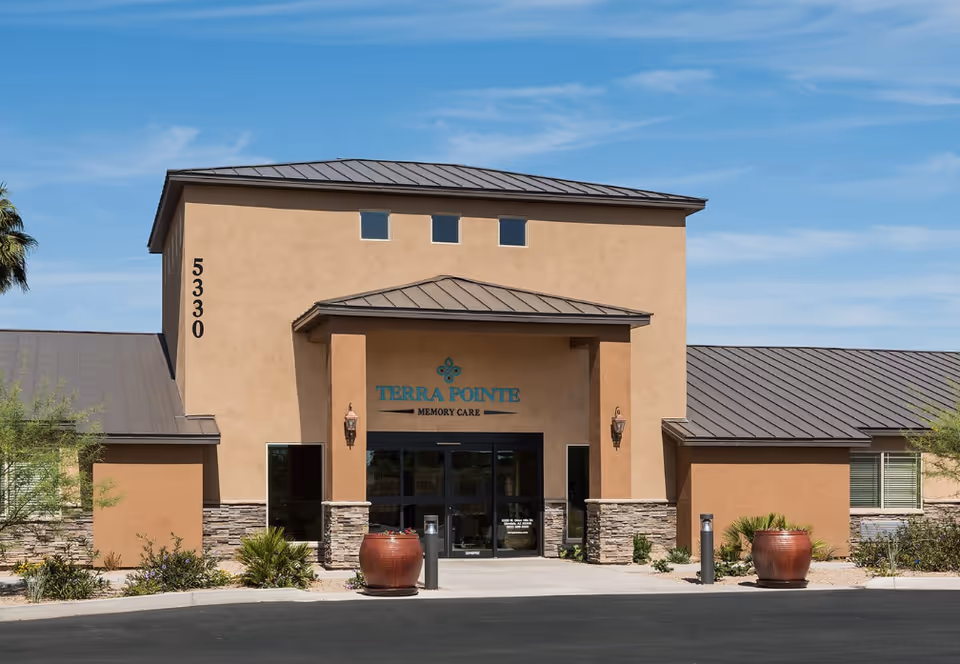 Front view of Terra Pointe Memory Care building with entrance and signage.