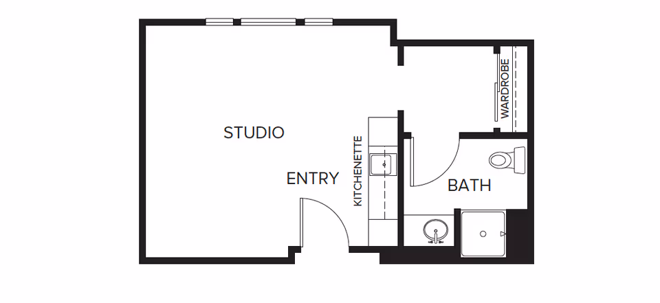 Floor plan of a studio apartment at Carmel Village showing an entry area leading to a kitchenette, a studio living space, and a bathroom with a toilet, sink, shower, and wardrobe.