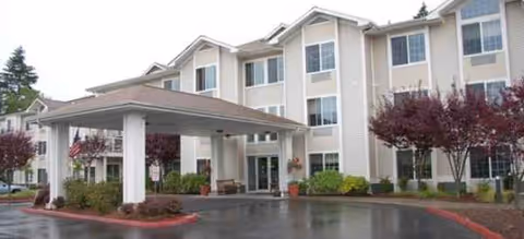 Front view of Brookdale Allenmore senior living building with covered entrance.