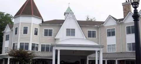 Brookdale Bath senior living facility exterior with a white front entrance and peaked rooflines.